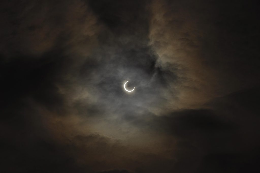 Solar Eclipse with semi cloudy skies